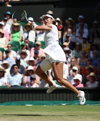 Philippines Alexandra Eala plays a forehand in her match against Italian Jasmine Paolini at Wimbledon on day eight of the 2026 Wimbledon Championships in London on Monday, July 06, 2026.  LON2026070612 HUGOxPHILPOTT