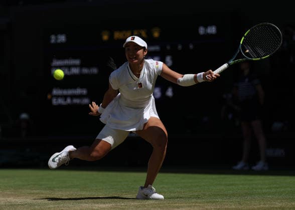 6th July 2026; All England Lawn Tennis and Croquet Club, London, England; Wimbledon Tennis Tournament, Day Eight; Alexandra Eala (PHL) with a forehand shot to Jasmine Paolini (ITA) JohnxPatrickxFletcher
