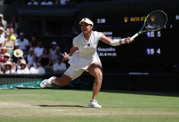 Philippines Alexandra Eala plays a forehand in her match against Italian Jasmine Paolini at Wimbledon on day eight of the 2026 Wimbledon Championships in London on Monday, July 06, 2026.  LON2026070636 HUGOxPHILPOTT