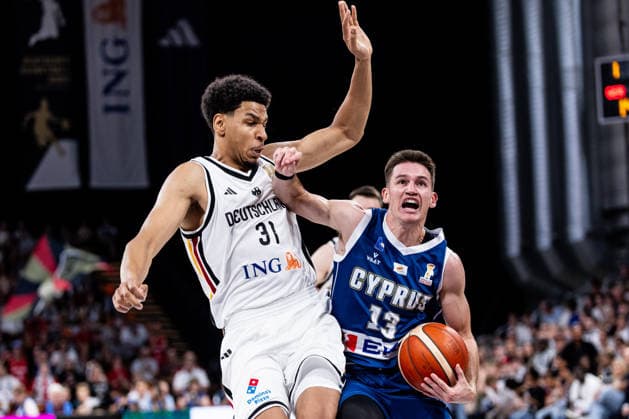 BAMBERG, GERMANY - JULY 06: Filippos Tigkas (Cyprus, 13) controls the ball against Sananda Fru (Germany, 31) during the FIBA Basketball World Cup European Qualifiers match between Germany vs. Cyprus at Brose Arena on July 06, 2026 in Bamberg, Germany. Bavaria Germany Copyright: xSteffiexWunderlx