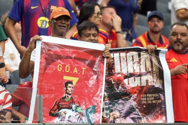 ARLINGTON, TX - JULY 06: Portugal fans hold up Cristiano Ronaldo 7 of Portugal (not pictured) GOAT signs ahead of the FIFA World Cup, WM, Weltmeisterschaft, Fussball 2026 Round of 16 match between Portugal and Spain on July 6, 2026, at Dallas Stadium in Arlington, Texas. (Photo by David Buono Icon Sportswire) SOCCER: JUL 06 FIFA World Cup 26 Round of 16 - Portugal vs Spain EDITORIAL USE ONLY Icon260706150