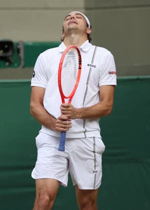 American Taylor Fritz reacts in his match against Kazakstahn s Alexander Bublik at Wimbledon on day eight of the 2026 Wimbledon Championships in London on Monday, July 06, 2026.  LON2026070684 HUGOxPHILPOTT
