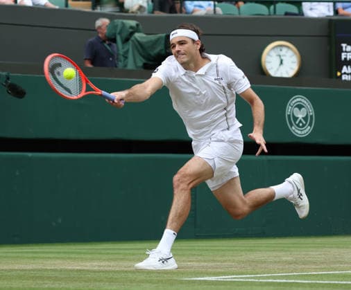 American Taylor Fritz plays a forehand in his match against Kazakstahn s Alexander Bublik at Wimbledon on day eight of the 2026 Wimbledon Championships in London on Monday, July 06, 2026.  LON2026070690 HUGOxPHILPOTT
