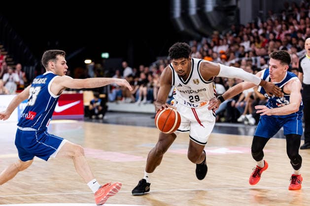 BAMBERG, GERMANY - JULY 06: Kostja Mushidi (Germany, 29) controls the ball against Stefanos Tigkas (Cyprus, 23) and Filippos Tigkas (Cyprus, 13) during the FIBA Basketball World Cup European Qualifiers match between Germany vs. Cyprus at Brose Arena on July 06, 2026 in Bamberg, Germany. Bavaria Germany Copyright: xSteffiexWunderlx