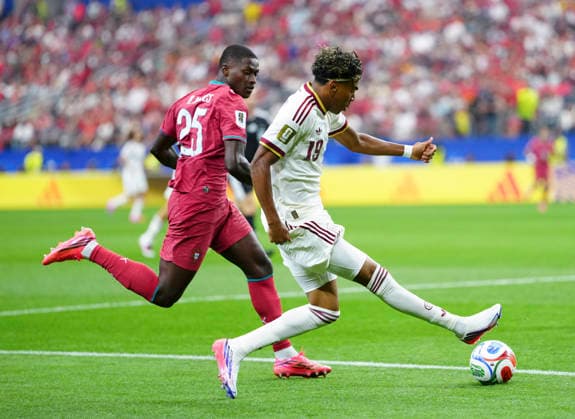 (260707) -- DALLAS, July 7, 2026 -- Lamine Yamal (R) of Spain vies with Nuno Mendes of Portugal during the round of 16 match between Spain and Portugal at the 2026 FIFA World Cup, WM, Weltmeisterschaft, Fussball at Dallas Stadium in Dallas, the United States, July 6, 2026. ) (SP)U.S.-DALLAS-FOOTBALL-FIFA WORLD CUP-ROUND OF 16-ESP VS POR JiaxHaocheng 