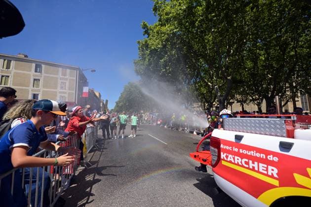 Firefighters spray the spectators with water at the start of stage 4 of the 2026 Tour de France cycling race, a stage of 181,9km from Carcassonne to Foix, on Tuesday 07 July 2026. The 113th edition of the Tour de France starts on Saturday 4 July in Barcelona, Spain, and will finish in Paris, France on the 26th of July. DAVIDxPINTENS  x180592287x