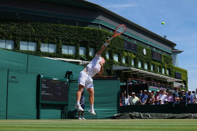 RECORD DATE NOT STATED 7th July 2026; All England Lawn Tennis and Croquet Club, London, England; Wimbledon Tennis Tournament, Day Nine; Jamie Mackenzie (GER) serves to Mark Ceban (GBR) with the backdrop of Centre Court JohnxPatrickxFletcher