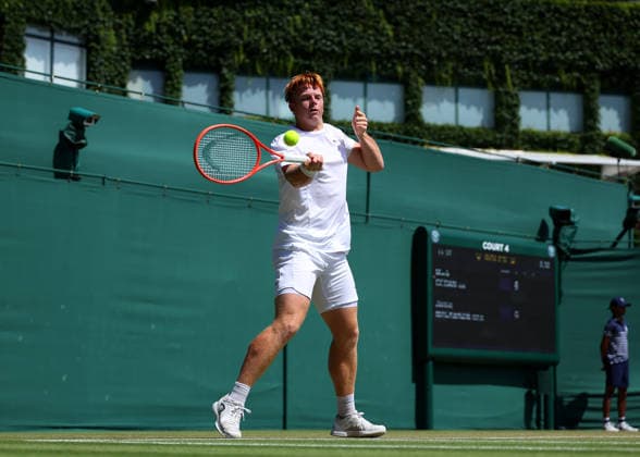 RECORD DATE NOT STATED 7th July 2026; All England Lawn Tennis and Croquet Club, London, England; Wimbledon Tennis Tournament, Day Nine; Jamie Mackenzie (GER) with a forehand shot to Mark Ceban (GBR) JohnxPatrickxFletcher