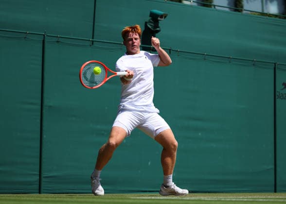 RECORD DATE NOT STATED 7th July 2026; All England Lawn Tennis and Croquet Club, London, England; Wimbledon Tennis Tournament, Day Nine; Jamie Mackenzie (GER) with a forehand shot to Mark Ceban (GBR) JohnxPatrickxFletcher
