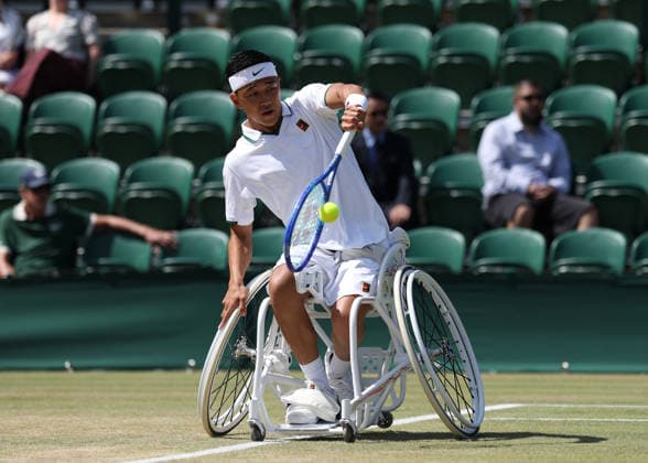 RECORD DATE NOT STATED 7th July 2026; All England Lawn Tennis and Croquet Club, London, England; Wimbledon Tennis Tournament, Day Nine; Tokito Oda (JPN) with a backhand shot to Gordon Reid (GBR) JohnxPatrickxFletcher