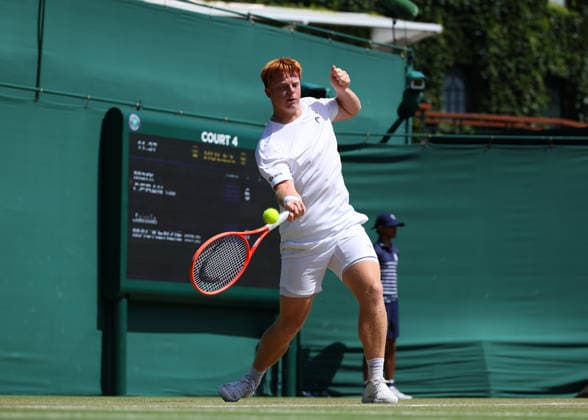 RECORD DATE NOT STATED 7th July 2026; All England Lawn Tennis and Croquet Club, London, England; Wimbledon Tennis Tournament, Day Nine; Jamie Mackenzie (GER) with a forehand shot to Mark Ceban (GBR) JohnxPatrickxFletcher