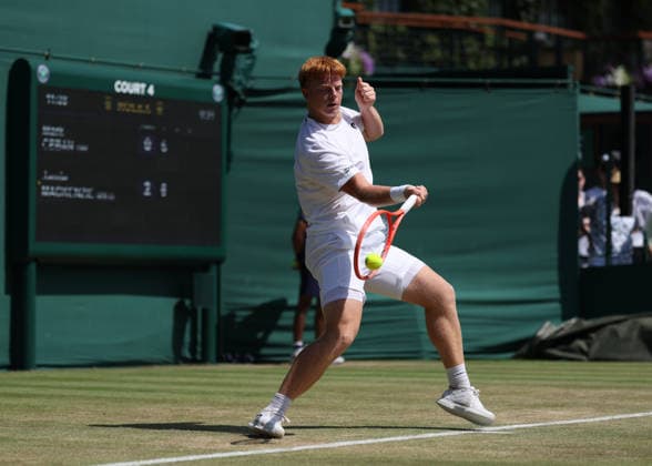 RECORD DATE NOT STATED 7th July 2026; All England Lawn Tennis and Croquet Club, London, England; Wimbledon Tennis Tournament, Day Nine; Jamie Mackenzie (GER) with a forehand shot to Mark Ceban (GBR) JohnxPatrickxFletcher
