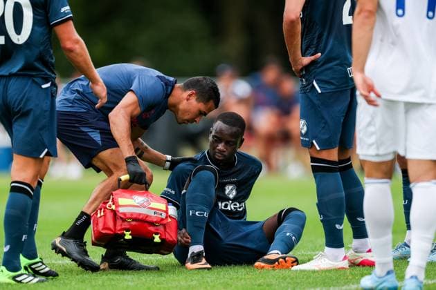 HAAKSBERGEN , 07-07-2026 , Ontmoetingspark De Greune , season 2026 2027 , Dutch pre-season football , friendly match between FC Utrecht and Apollon FC , picture shows FC Utrecht player Yoann Cathline receives medical attention Utrecht - Apollon  x204909039x Copyright: