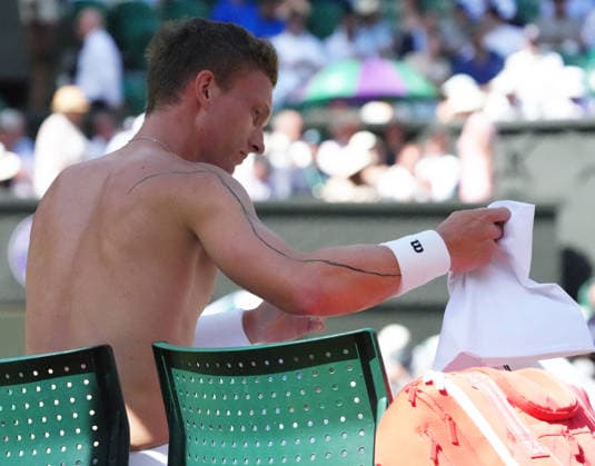 Tennis - 2026 Wimbledon Championships - Day Eight (Week Two) - All England Lawn Tennis & Croquet Club, London - Tuesday 7th July 2026 Center Court : Mens Singles : Jiri Lehecka (CZE) v Alexander Zverev (GER) Jiri Lehecka (CZE) with tattoo line running down his right arm COLORSPORT ANDREW COWIE 