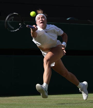 Czech Karolina Muchova plays a forehand in her Women s Quarter-Finals match against Japan s Naomi Osaka on day nine of the 2026 Wimbledon Championships in London on Tuesday, July 7, 2026.  LON2026070752 HUGOxPHILPOTT