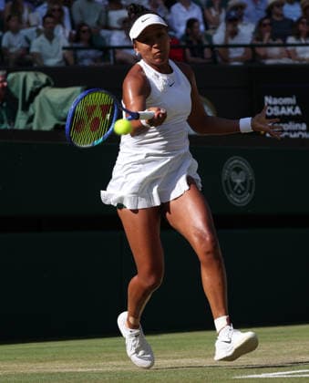 Japan s Naomi Osaka plays a forehand in her Women s Quarter-Finals match against Czech Karolina Muchova on day nine of the 2026 Wimbledon Championships in London on Tuesday, July 7, 2026.  LON2026070772 HUGOxPHILPOTT