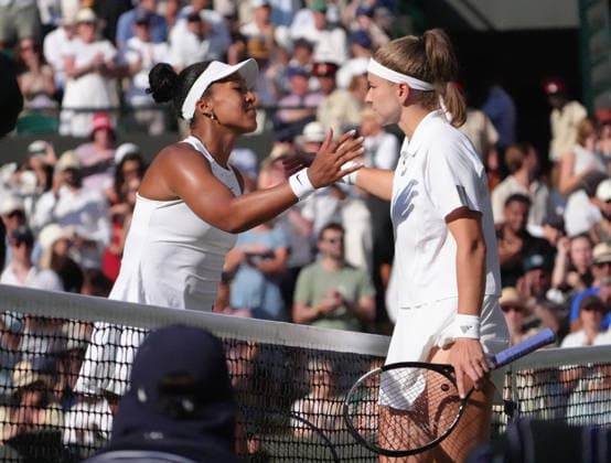 Tennis - 2026 Wimbledon Championships - Day Eight (Week Two) - All England Lawn Tennis & Croquet Club, London - Tuesday 7th July 2026 Court One: Womens Singles : Naomi Osaka (JPN) v Karolina Muchova (CZE) Karolina Muchova (CZE) after winning for the match with Osaka at the net COLORSPORT ANDREW COWIE 