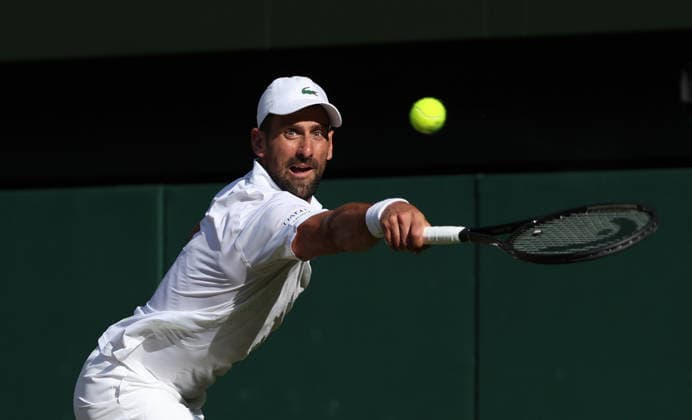 Serbian Novak Djokovic plays a backhand in his Men s Quarter-Finals match against Canada s Felix Auger Aliassime on day nine of the 2026 Wimbledon Championships in London on Tuesday, July 07, 2026.  LON2026070786 HUGOxPHILPOTT