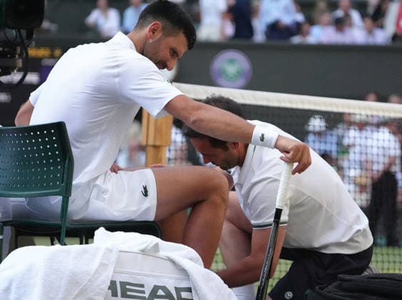 Tennis - 2026 Wimbledon Championships - Day Eight (Week Two) - All England Lawn Tennis & Croquet Club, London - Tuesday 7th July 2026 Centre Court : Mens Singles : Felix Auger - Aliassime (CAN) v Novak Djokovic (SEB) Novak Djokovic (SEB) receives treatment to his left calf muscle COLORSPORT ANDREW COWIE 