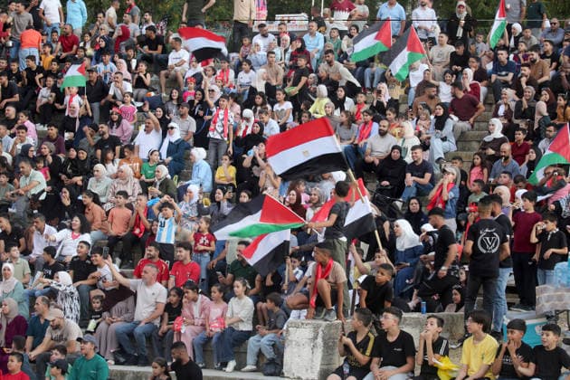 July 7, 2026, Nablus, Palestine: Palestinians wave Palestinian and Egyptian flags while watching the World Cup match between Egypt and Argentina. Palestinian fans seen at Jamal Abdel Nasser Stadium, watching the match via live World Cup broadcast big screen tv. Final scores; Argentina 3 : 2 Egypt. Egypt Vs Argentina In Nablus, Palestine - 07 Jul 2026  - ZUMAs197 20260707_aaa_s197_058 Copyright: xNasserxIshtayehx