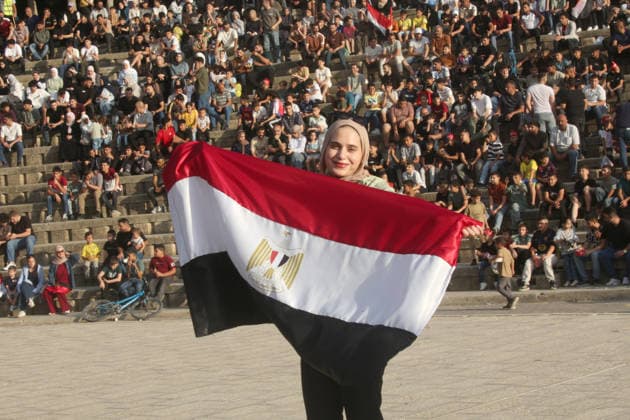July 7, 2026, Nablus, Palestine: A Palestinian lady holds an Egyptian flag while watching the World Cup match between Egypt and Argentina. Palestinian fans seen at Jamal Abdel Nasser Stadium, watching the match via live World Cup broadcast big screen tv. Final scores; Argentina 3 : 2 Egypt. Egypt Vs Argentina In Nablus, Palestine - 07 Jul 2026  - ZUMAs197 20260707_aaa_s197_059 Copyright: xNasserxIshtayehx
