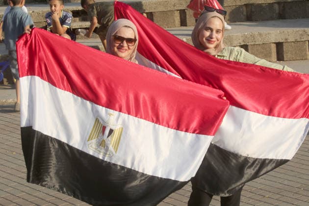 July 7, 2026, Nablus, Palestine: Palestinian ladies hold the Egyptian flags while watching the World Cup match between Egypt and Argentina. Palestinian fans seen at Jamal Abdel Nasser Stadium, watching the match via live World Cup broadcast big screen tv. Final scores; Argentina 3 : 2 Egypt. Egypt Vs Argentina In Nablus, Palestine - 07 Jul 2026  - ZUMAs197 20260707_aaa_s197_061 Copyright: xNasserxIshtayehx