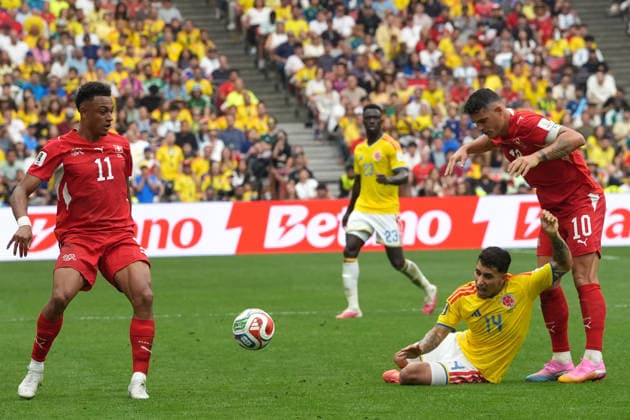 Granit Xhaka (R) of Switzerland battles for the ball with Gustavo Puerta (L) of Colombia during a Round of 16 match at the 2026 FIFA World Cup, WM, Weltmeisterschaft, Fussball between Switzerland and Colombia at BC Place Stadium in Vancouver, Canada, 07 July 2026. 2026 FIFA World Cup - Round of 16 - Switzerland vs. Colombia !ACHTUNG: NUR REDAKTIONELLE NUTZUNG!  Copyright: xOmarxAlonsox AMDEP8482 20260707-55020831425_1