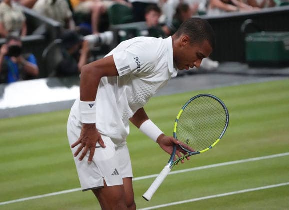 Tennis - 2026 Wimbledon Championships - Day Eight (Week Two) - All England Lawn Tennis & Croquet Club, London - Tuesday 7th July 2026 Centre Court : Mens Singles : Felix Auger - Aliassime (CAN) v Novak Djokovic (SEB) Felix Auger - Aliassime (CAN) close to defeat COLORSPORT ANDREW COWIE 