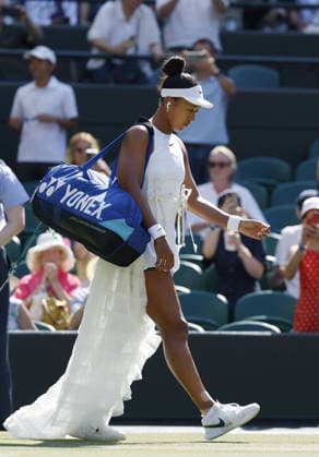 Tennis: Wimbledon championships Naomi Osaka of Japan enters the court before playing against Karolina Muchova of the Czech Republic in the women s singles quarterfinals at the Wimbledon tennis tournament in London on July 7, 2026.  A14AA0005622065P
