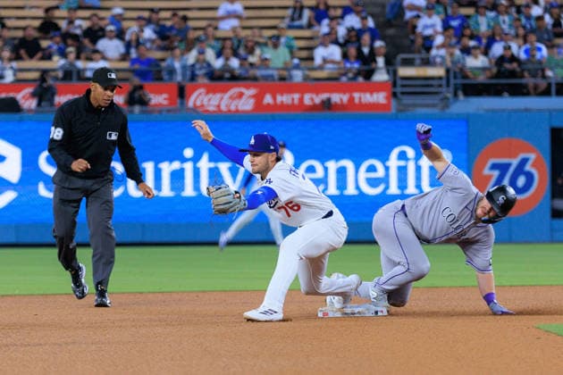 July 7, 2026, Los Angeles, California, USA: Alex Freeland 76 of the Los Angeles Dodgers is unable to make an out on Braxton Fulford 37 of the Colorado Rockies during a regular season MLB, Baseball Herren, USA game on Tuesday July 7, 2026 at Dodger Stadium in Los Angeles, California. JAVIER ROJAS PI Dodgers Lose To Rockies, 3-4  - ZUMAp124 20260707_zaa_p124_034 Copyright: xJavierxRojasx