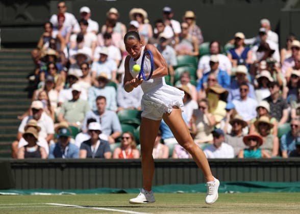 RECORD DATE NOT STATED 8th July 2026; All England Lawn Tennis and Croquet Club, London, England; Wimbledon Tennis Tournament, Day Ten; Marta Kostyuk (UKR) with a backhand shot to Jasmine Paolini (ITA) JohnxPatrickxFletcher
