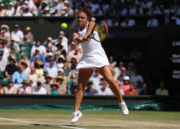RECORD DATE NOT STATED 8th July 2026; All England Lawn Tennis and Croquet Club, London, England; Wimbledon Tennis Tournament, Day Ten; Jasmine Paolini (ITA) with a backhand shot to Marta Kostyuk (UKR) JohnxPatrickxFletcher
