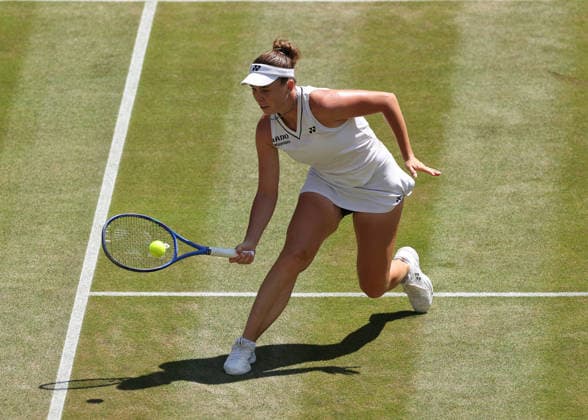 RECORD DATE NOT STATED 8th July 2026; All England Lawn Tennis and Croquet Club, London, England; Wimbledon Tennis Tournament, Day Ten; Linda Noskova (CZE) plays a shot at the net against Elise Mertens (BEL) JohnxPatrickxFletcher