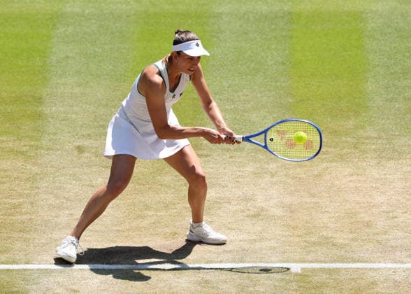 RECORD DATE NOT STATED 8th July 2026; All England Lawn Tennis and Croquet Club, London, England; Wimbledon Tennis Tournament, Day Ten; Elise Mertens (BEL) with a backhand shot to Linda Noskova (CZE) JohnxPatrickxFletcher