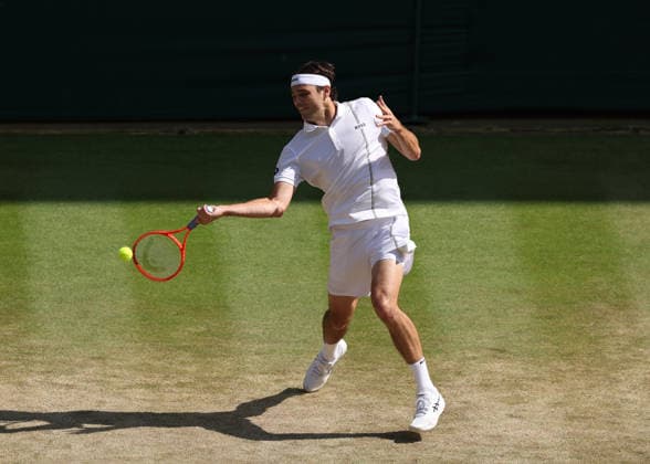 RECORD DATE NOT STATED 8th July 2026; All England Lawn Tennis and Croquet Club, London, England; Wimbledon Tennis Tournament, Day Ten; Taylor Fritz (USA) with a forehand shot to Alexander Zverev (GER) JohnxPatrickxFletcher
