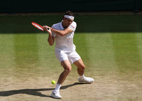 RECORD DATE NOT STATED 8th July 2026; All England Lawn Tennis and Croquet Club, London, England; Wimbledon Tennis Tournament, Day Ten; Taylor Fritz (USA) with a backhand shot to Alexander Zverev (GER) JohnxPatrickxFletcher