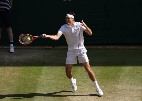 RECORD DATE NOT STATED 8th July 2026; All England Lawn Tennis and Croquet Club, London, England; Wimbledon Tennis Tournament, Day Ten; Taylor Fritz (USA) with a forehand shot to Alexander Zverev (GER) JohnxPatrickxFletcher