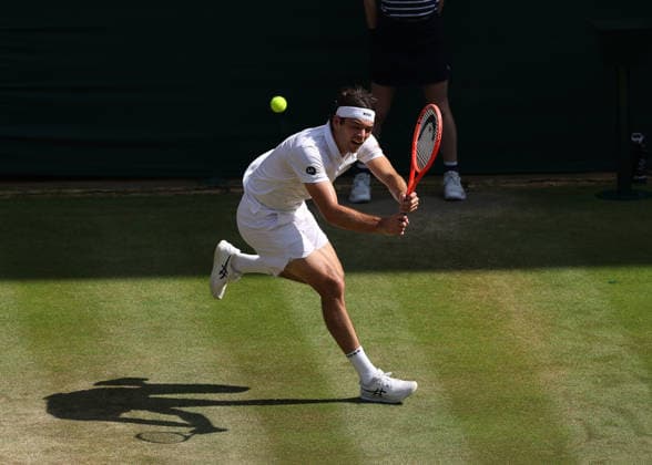 RECORD DATE NOT STATED 8th July 2026; All England Lawn Tennis and Croquet Club, London, England; Wimbledon Tennis Tournament, Day Ten; Taylor Fritz (USA) with a backhand shot to Alexander Zverev (GER) JohnxPatrickxFletcher