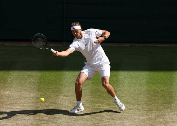 RECORD DATE NOT STATED 8th July 2026; All England Lawn Tennis and Croquet Club, London, England; Wimbledon Tennis Tournament, Day Ten; Alexander Zverev (GER) with a forehand shot to Taylor Fritz (USA) JohnxPatrickxFletcher