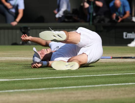Great Britain s Arthur Fery falls over after victory in his Men s Quarter-Finals match against Italy s Flavio Cobolli on day Ten of the 2026 Wimbledon Championships in London on Wednesday, July 08,2026.  LON2026070850 HUGOxPHILPOTT
