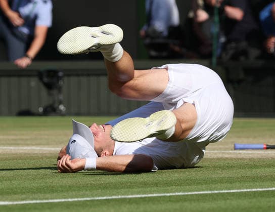 Great Britain s Arthur Fery falls over after victory in his Men s Quarter-Finals match against Italy s Flavio Cobolli on day Ten of the 2026 Wimbledon Championships in London on Wednesday, July 08,2026.  LON2026070854 HUGOxPHILPOTT