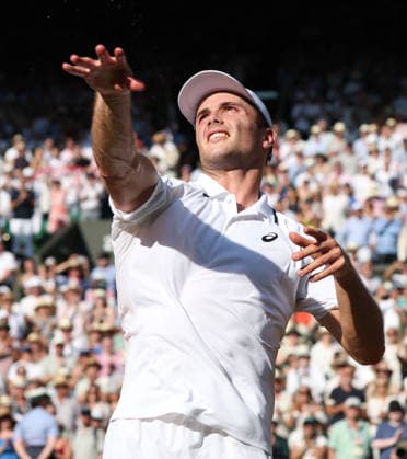 Great Britain s Arthur Fery falls over after victory in his Men s Quarter-Finals match against Italy s Flavio Cobolli on day Ten of the 2026 Wimbledon Championships in London on Wednesday, July 08,2026.  LON2026070856 HUGOxPHILPOTT