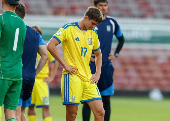 Wrexham, Wales, 8th July 2026. Oleksandr Kamenskyi of Ukraine reacts at the full time result as Ukraine lose their Semi Final following the Ukraine U19 vs Germany U19 UEFA European U19 Championship match at The Racecourse, Wrexham. Picture credit should read: Cody Froggatt Sportimage EDITORIAL USE ONLY. No use with unauthorised audio, video, data, fixture lists, club league logos or live services. Online in-match use limited to 120 images, no video emulation. No use in betting, games or single club league player publications. SPI_051_CF_UKRAINE_U19_V_GERMANY_U19 SPI-4857-0050