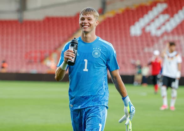 Wrexham, Wales, 8th July 2026. Florian Hellstern of Germany all smiles as he celebrates the full time result as Germany qualify for the UEFA European U19 Championship final following the Ukraine U19 vs Germany U19 UEFA European U19 Championship match at The Racecourse, Wrexham. Picture credit should read: Cody Froggatt Sportimage EDITORIAL USE ONLY. No use with unauthorised audio, video, data, fixture lists, club league logos or live services. Online in-match use limited to 120 images, no video emulation. No use in betting, games or single club league player publications. SPI_054_CF_UKRAINE_U19_V_GERMANY_U19 SPI-4857-0053