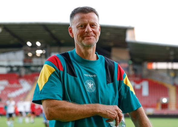 Wrexham, Wales, 8th July 2026. Christian Worns head coach of Germany all smiles as he celebrates the full time result as Germany qualify for the UEFA European U19 Championship final following the Ukraine U19 vs Germany U19 UEFA European U19 Championship match at The Racecourse, Wrexham. Picture credit should read: Cody Froggatt Sportimage EDITORIAL USE ONLY. No use with unauthorised audio, video, data, fixture lists, club league logos or live services. Online in-match use limited to 120 images, no video emulation. No use in betting, games or single club league player publications. SPI_182_CF_UKRAINE_U19_V_GERMANY_U19 SPI-4857-0181