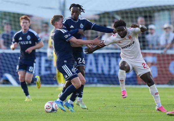 July 8, 2026, Burnaby, Bc, CANADA: Vancouver Whitecaps J.C. Ngando (26) and teammate Mihail Gherasimencov (29) collide while vying for the ball against Cavalry FC s Goteh Ntignee (20) during the first half of a Canadian Championship quarterfinal soccer match, in Burnaby, B.C., on Wednesday, July 8, 2026. Canada News - July 8, 2026  - ZUMAc35_ 20260708_zaf_c35_076 Copyright: xDarrylxDyckx