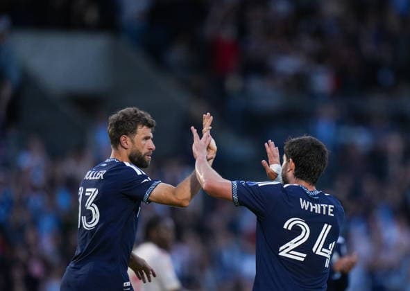 July 8, 2026, Burnaby, Bc, CANADA: Vancouver Whitecaps Thomas Muller (13) and Brian White (24) celebrate Muller s goal during the second half of a Canadian Championship quarterfinal soccer match against Cavalry FC, in Burnaby, B.C., on Wednesday, July 8, 2026. Canada News - July 8, 2026  - ZUMAc35_ 20260708_zaf_c35_086 Copyright: xDarrylxDyckx