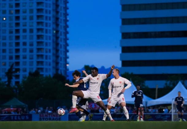 July 8, 2026, Burnaby, Bc, CANADA: Cavalry FC s Levi Laing (15) and Vancouver Whitecaps Nikola Djordjevic (41) vie for the ball as Cavalry FC s Harry Paton (8) watches during the second half of a Canadian Championship quarterfinal soccer match, in Burnaby, B.C., on Wednesday, July 8, 2026. Canada News - July 8, 2026  - ZUMAc35_ 20260708_zaf_c35_095 Copyright: xDarrylxDyckx