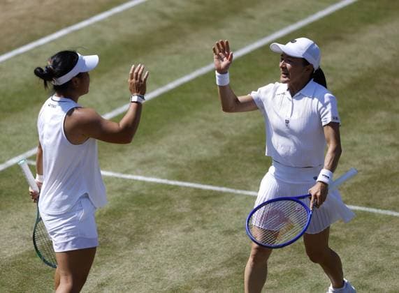 Tennis: Wimbledon championships Shuko Aoyama (R) of Japan and Liang En-shuo of Taiwan react after winning a point against Ellen Perez of Australia and Demi Schuurs of the Netherlands in the women s doubles quarterfinals at the Wimbledon tennis tournament in London on July 8, 2026.  A14AA0005622257P