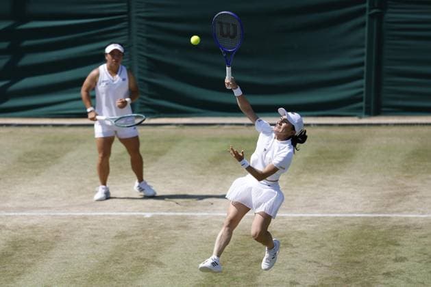 Tennis: Wimbledon championships Shuko Aoyama (R) of Japan and Liang En-shuo of Taiwan play against Ellen Perez of Australia and Demi Schuurs of the Netherlands in the women s doubles quarterfinals at the Wimbledon tennis tournament in London on July 8, 2026.  A14AA0005622260P